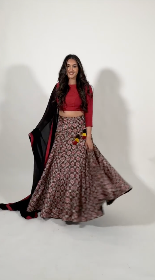 A model twirling and showcasing Kya Lehenga Choli Set by Raas