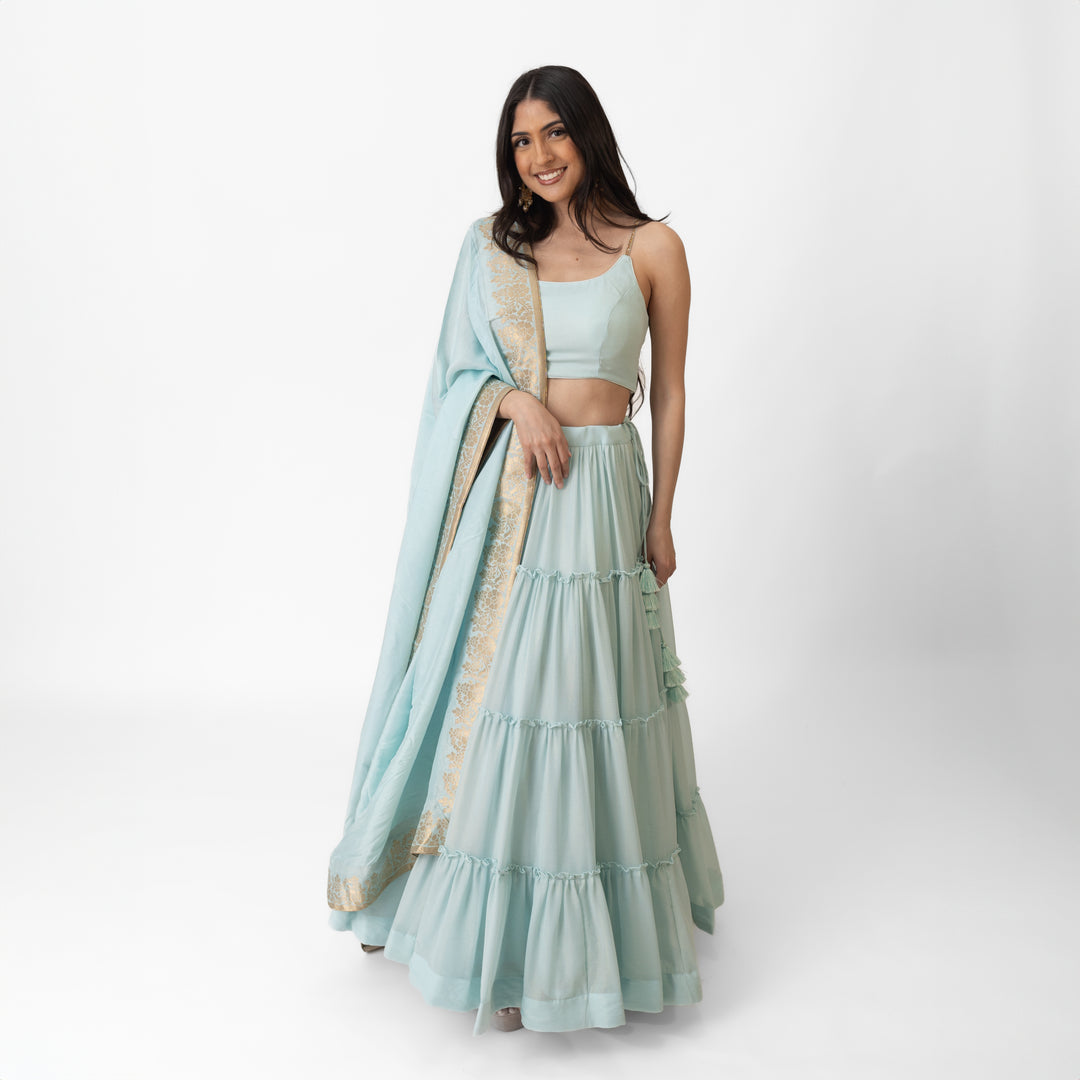 Elvia Sky Blue Shimmer Tiered Lehenga choli with Gold Accents