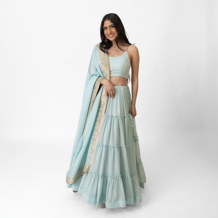 Elvia Sky Blue Shimmer Tiered Lehenga choli with Gold Accents