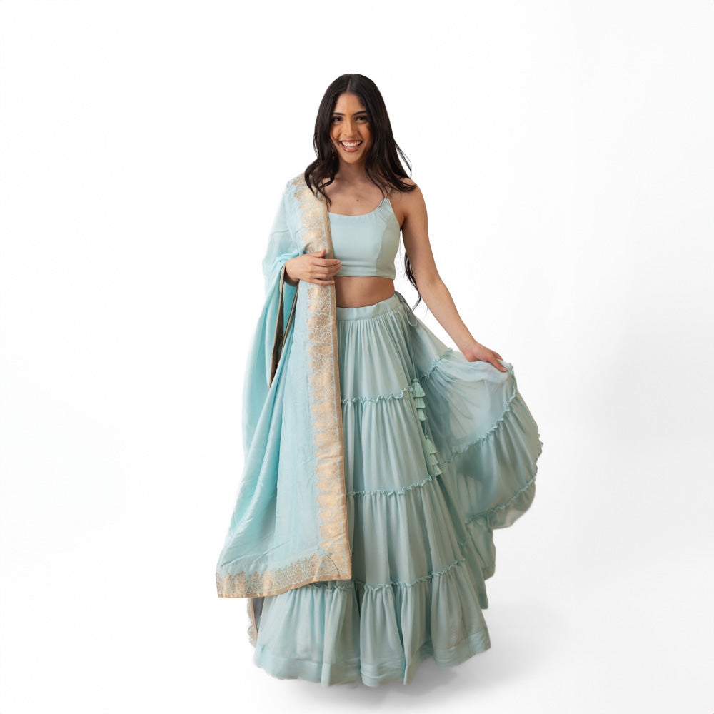 Elvia Sky Blue Shimmer Tiered Lehenga choli with Gold Accents