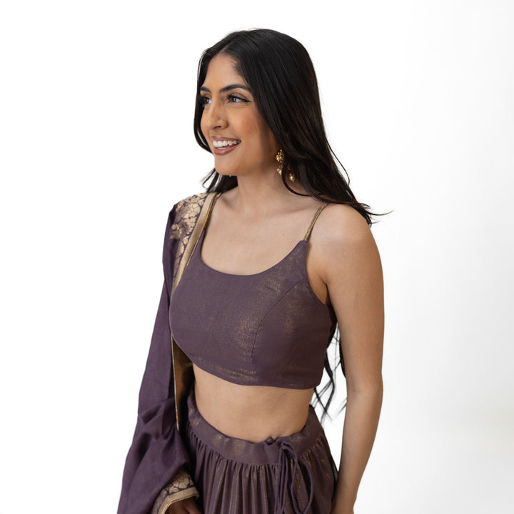 Gaia Brownish Purple Shimmer Tiered Lehenga set with Gold Accents