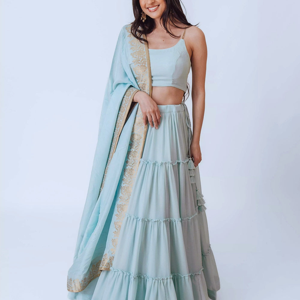 Elvia Sky Blue Shimmer Tiered Lehenga choli with Gold Accents