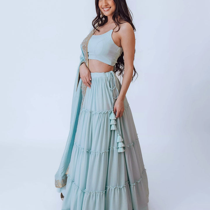 Elvia Sky Blue Shimmer Tiered Lehenga choli with Gold Accents