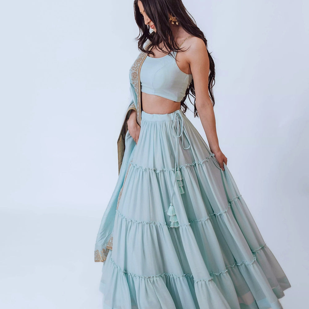 Elvia Sky Blue Shimmer Tiered Lehenga choli with Gold Accents