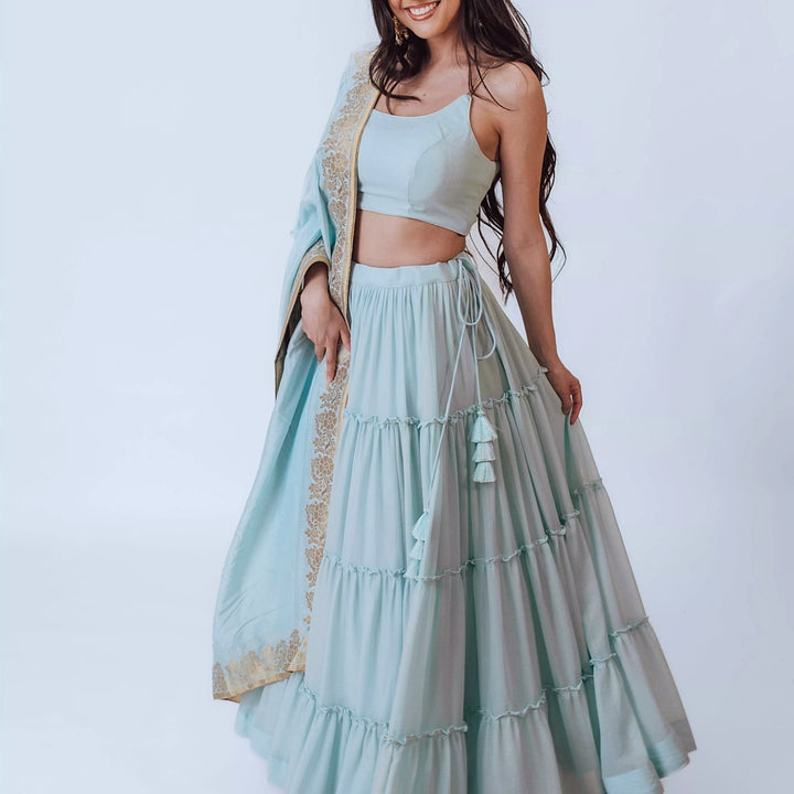 Elvia Sky Blue Shimmer Tiered Lehenga choli with Gold Accents