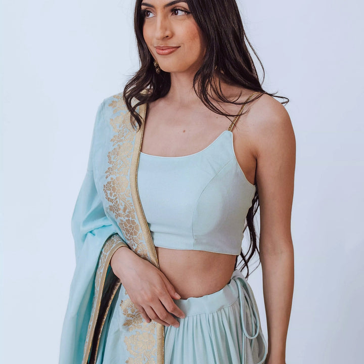 Elvia Sky Blue Shimmer Tiered Lehenga choli with Gold Accents