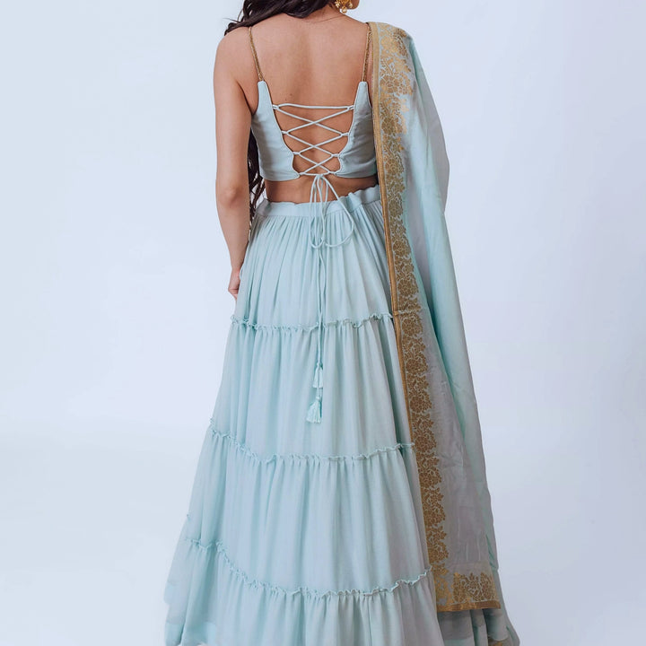 Elvia Sky Blue Shimmer Tiered Lehenga choli with Gold Accents