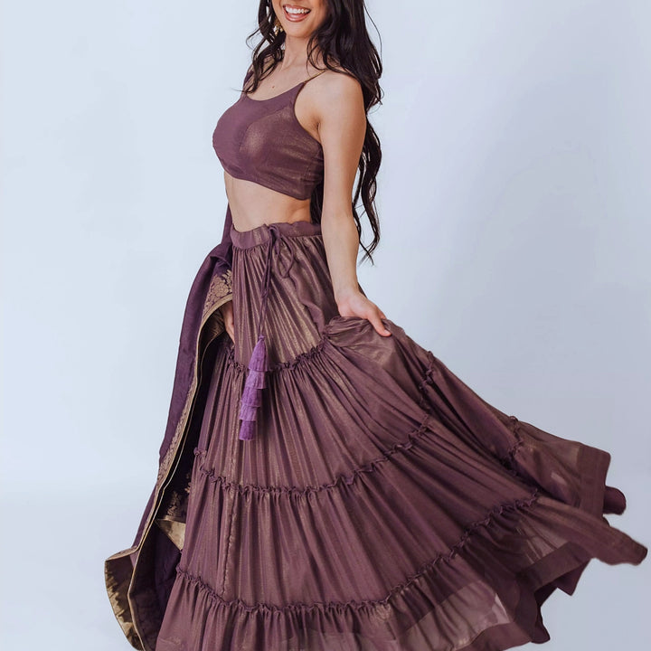 Gaia Brownish Purple Shimmer Tiered Lehenga set with Gold Accents