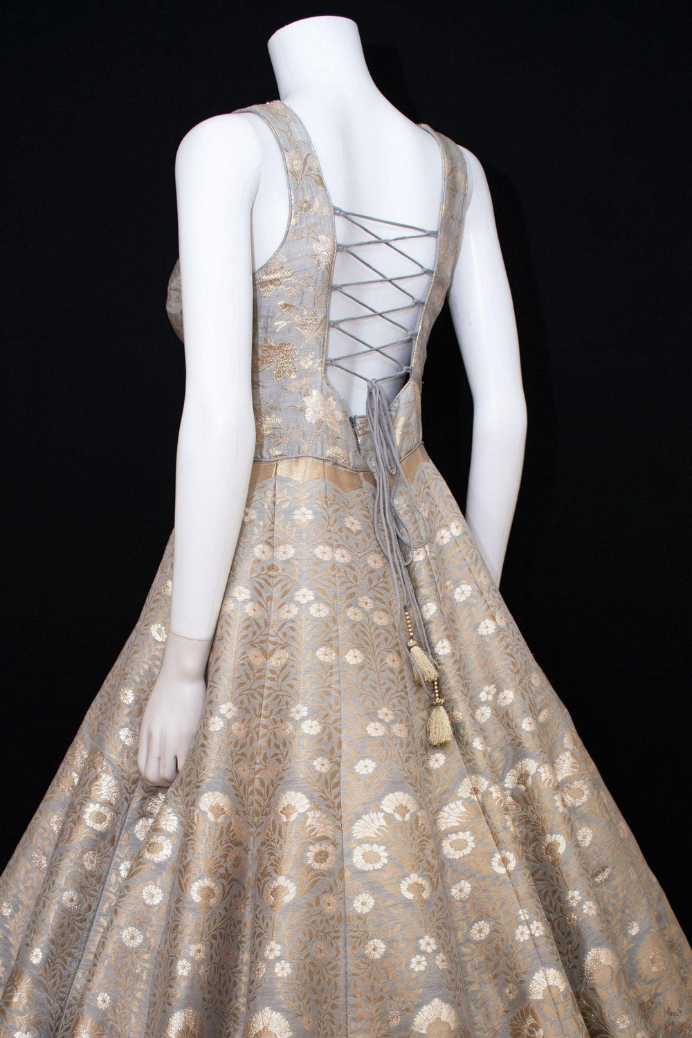Jacquard silk A-line gown with intricate floral patterns and a lace-up back.
