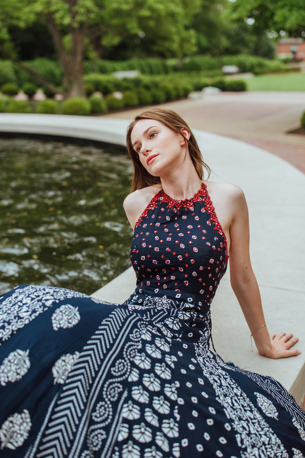 Aqua printed cotton gown with mirror and Resham embroidery, sleeveless, open back.