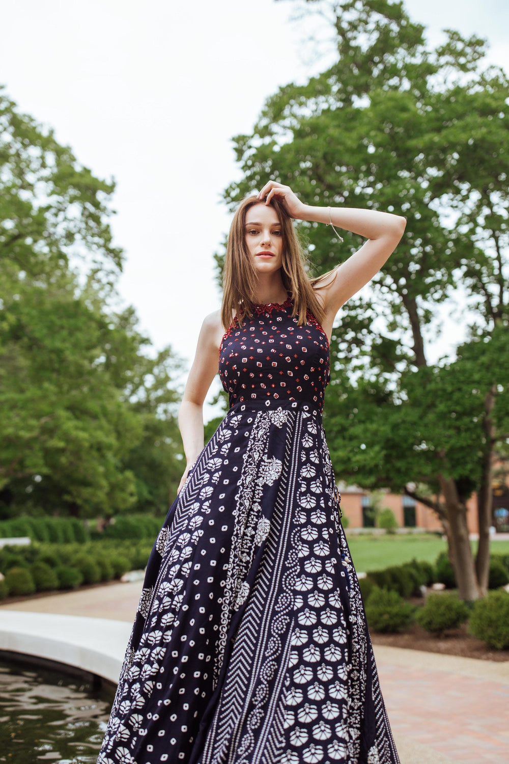 Aqua printed cotton gown with mirror and Resham embroidery on torso, sleeveless, flared silhouette.