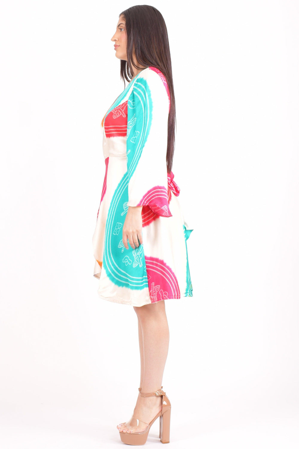Gaji silk Bandhani wrap dress with vibrant circular patterns in red, teal, and pink.