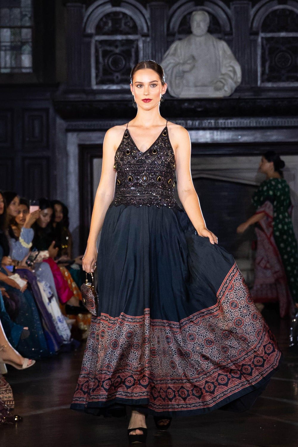 Black silk long dress with heavy hand-embroidered stone and resham work, ajrakh print skirt, V-neckline.
