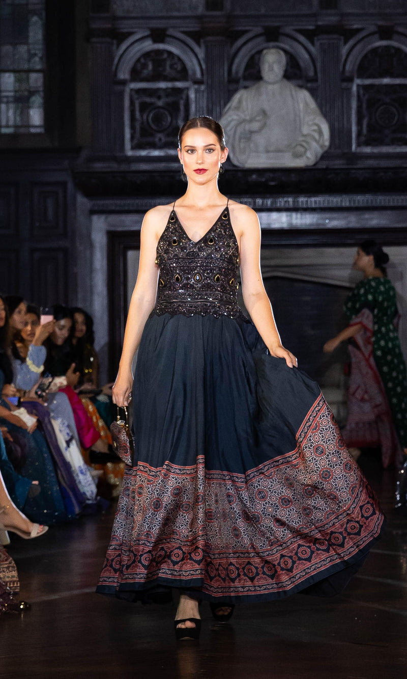 Black silk long dress with heavy hand-embroidered stone and resham work, ajrakh print skirt, V-neckline.