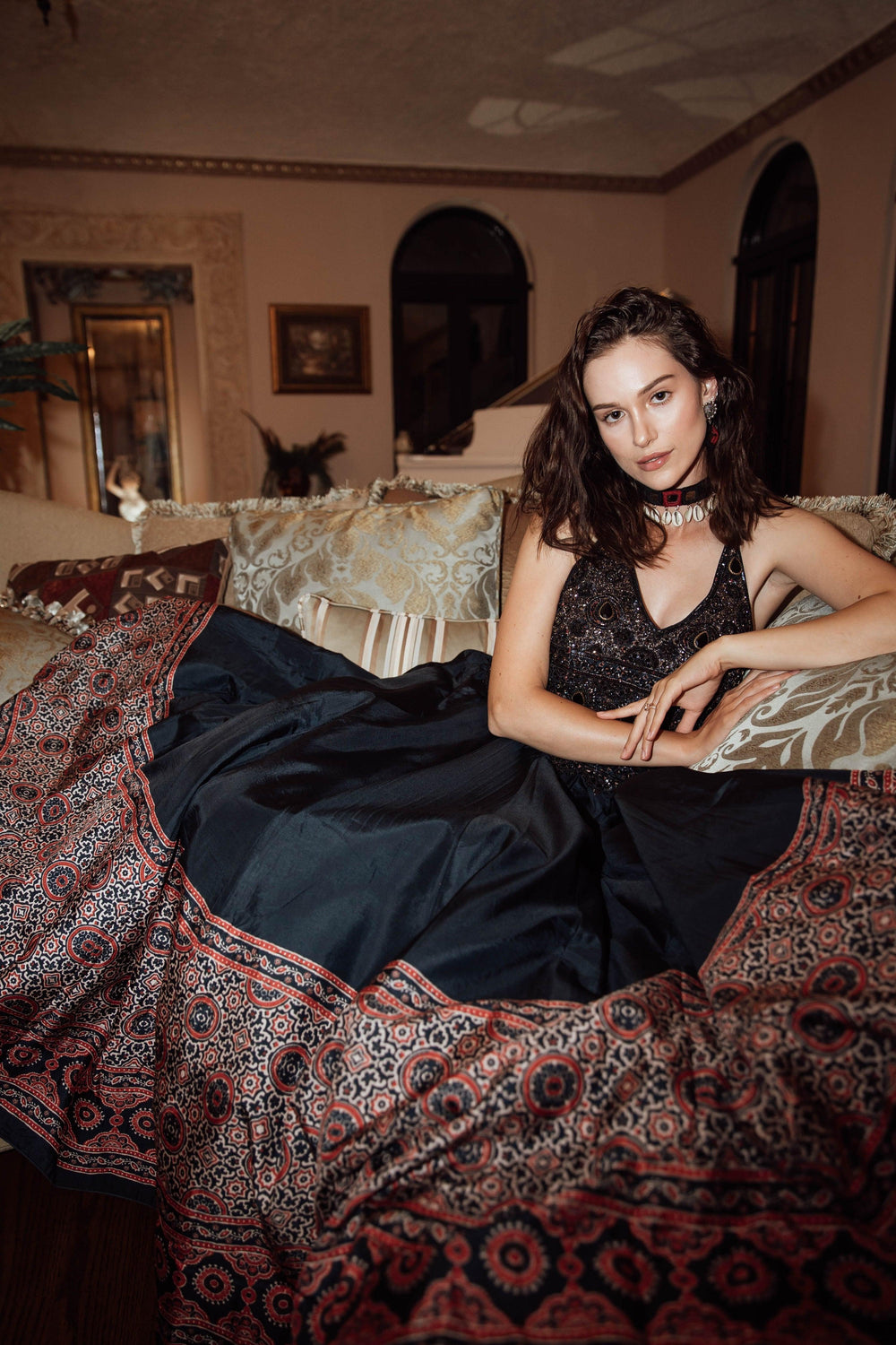 Black silk Ajrakh long dress with heavy hand-embroidered stone and resham work, V-neckline.