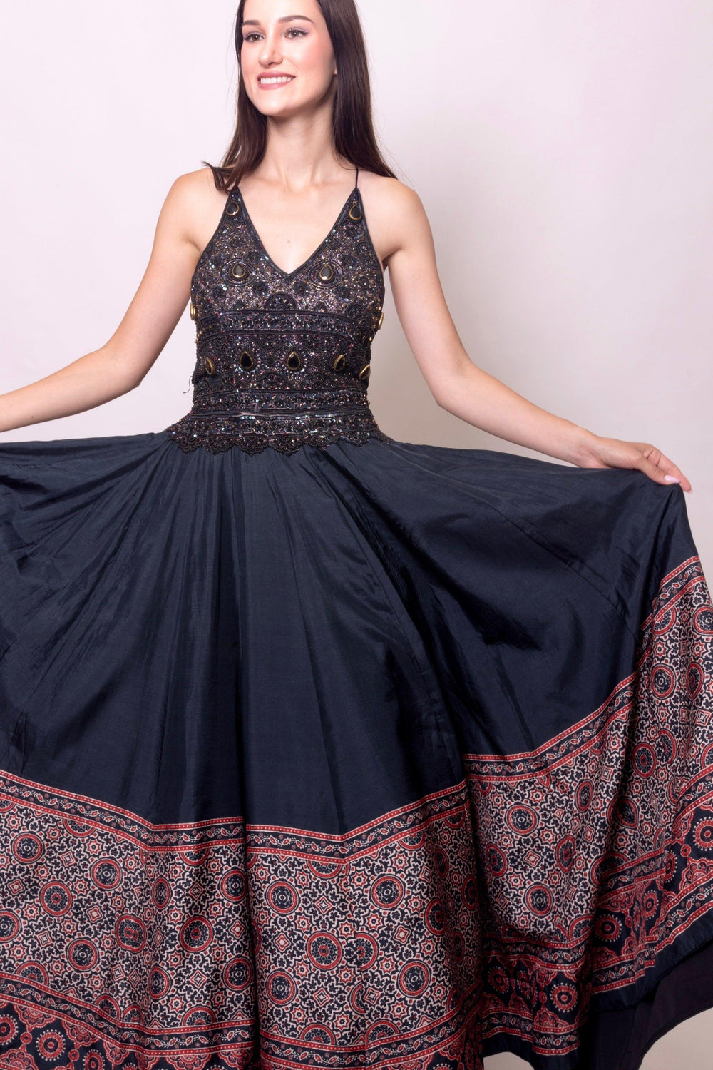 Black silk Ajrakh long dress with heavy hand-embroidered stone and resham work, V-neckline.