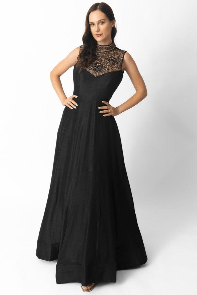 Black raw silk gown with high neckline and intricate hand embroidery on the torso.