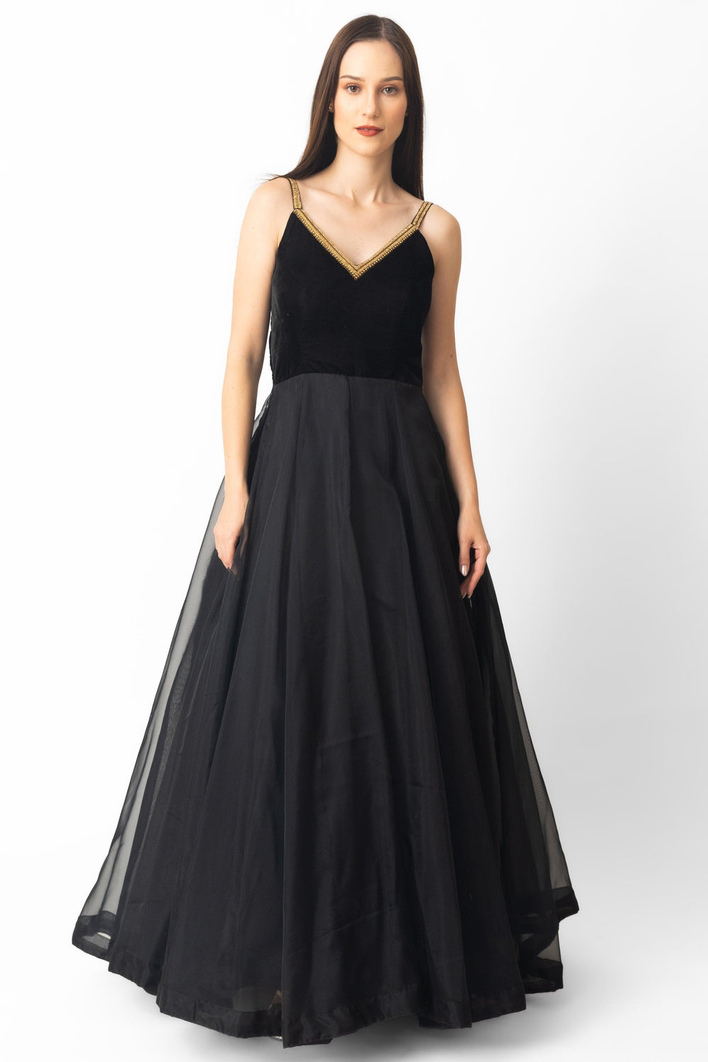 Black velvet and organza gown with golden hand-embroidered v-neckline and spaghetti straps.