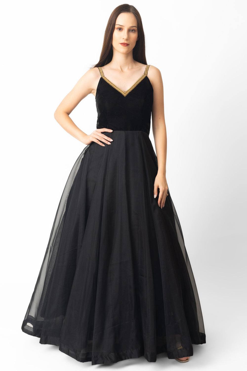 Black velvet and organza gown with hand-embroidered golden V-neckline and A-line silhouette.