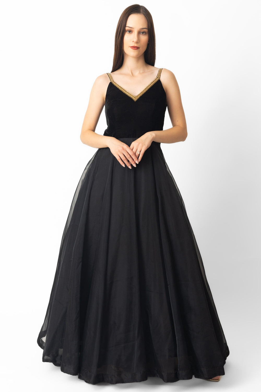 Black velvet and organza gown with golden hand-embroidered V-neckline and A-line silhouette.