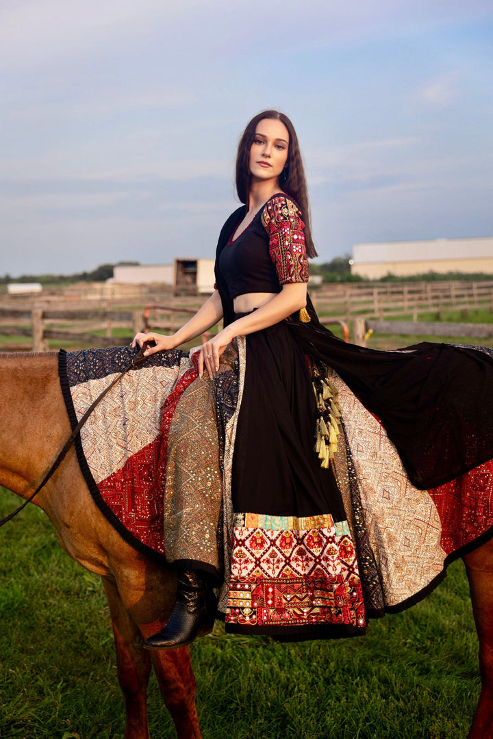 Andes Black Silk Lehenga Choli with multi-colored side panel, embroidered blouse, and dramatic flare.