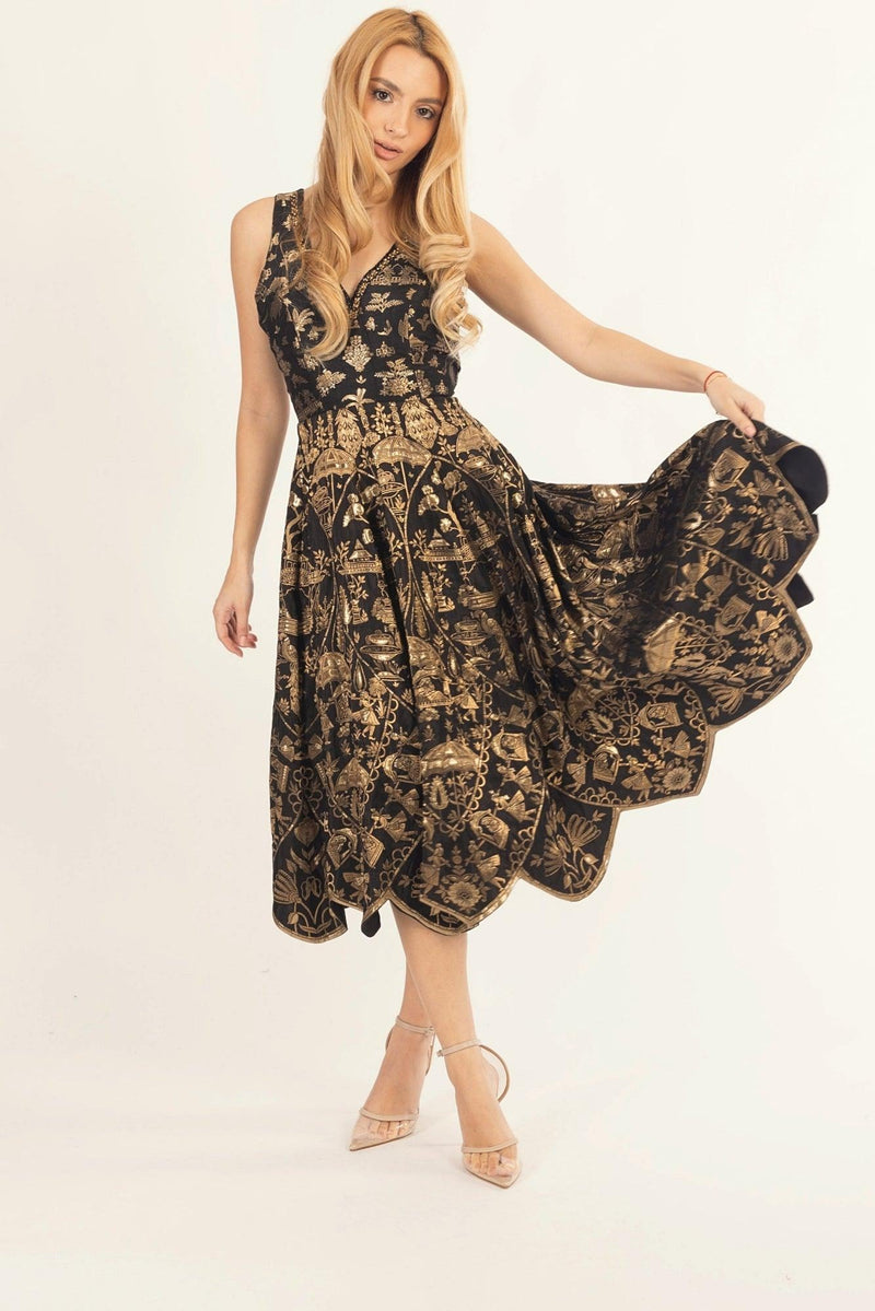 Black jacquard silk midi dress with golden patterns, hand-embroidered sweetheart neckline, and cutwork hem.