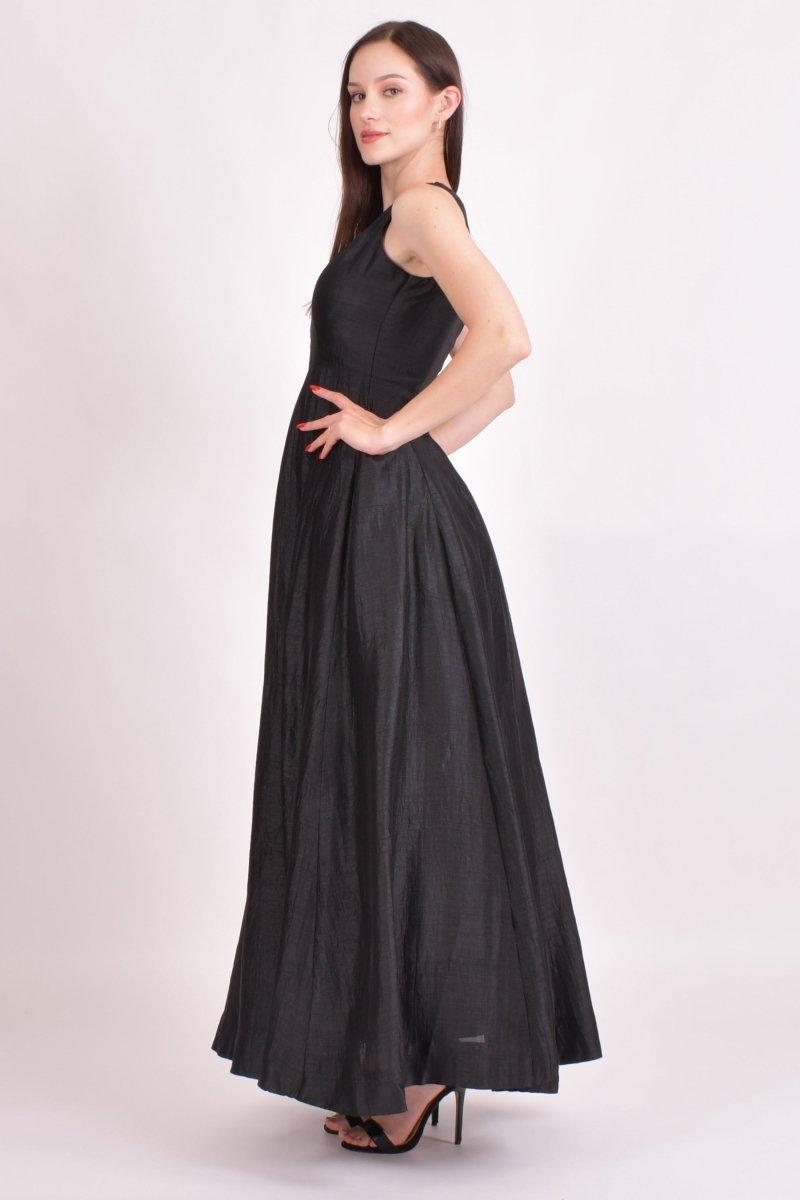 Black raw silk one-shoulder saree gown with intricate hand embroidery and a flowing mukaish work drape.