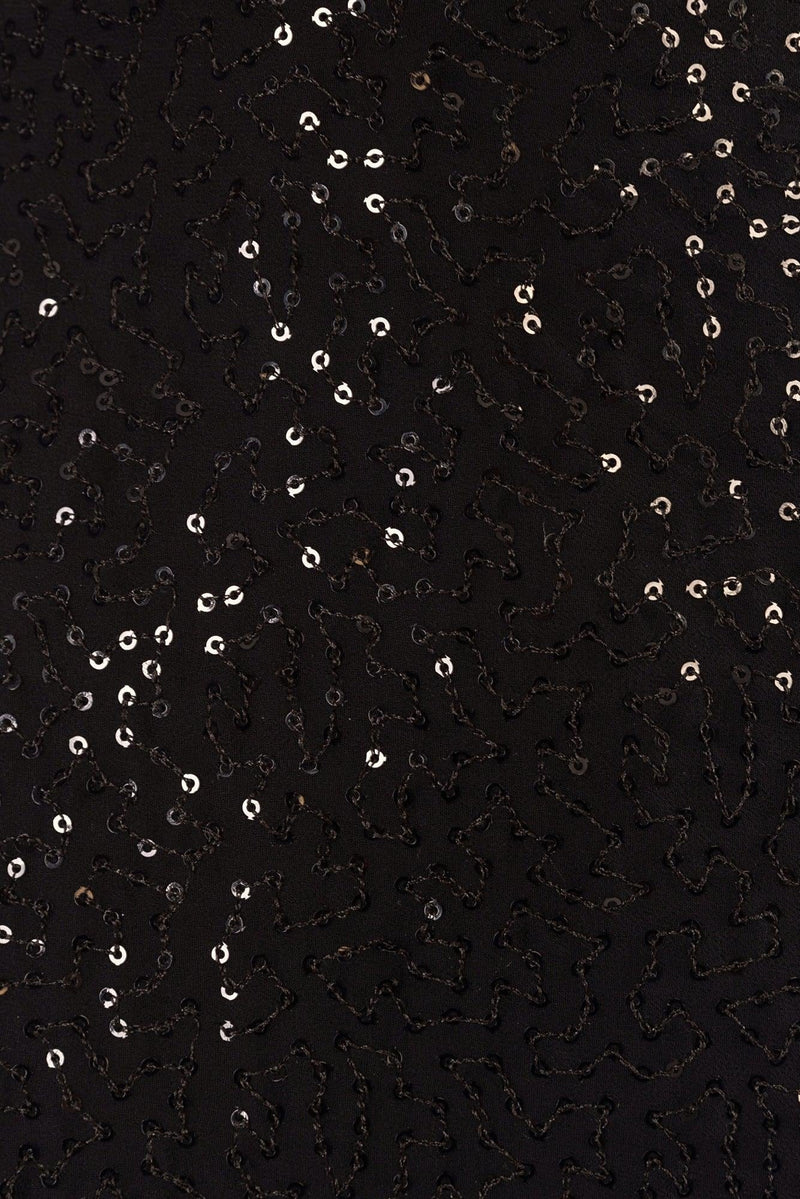 Close-up of black georgette fabric with all-over sequins and intricate resham embroidery.