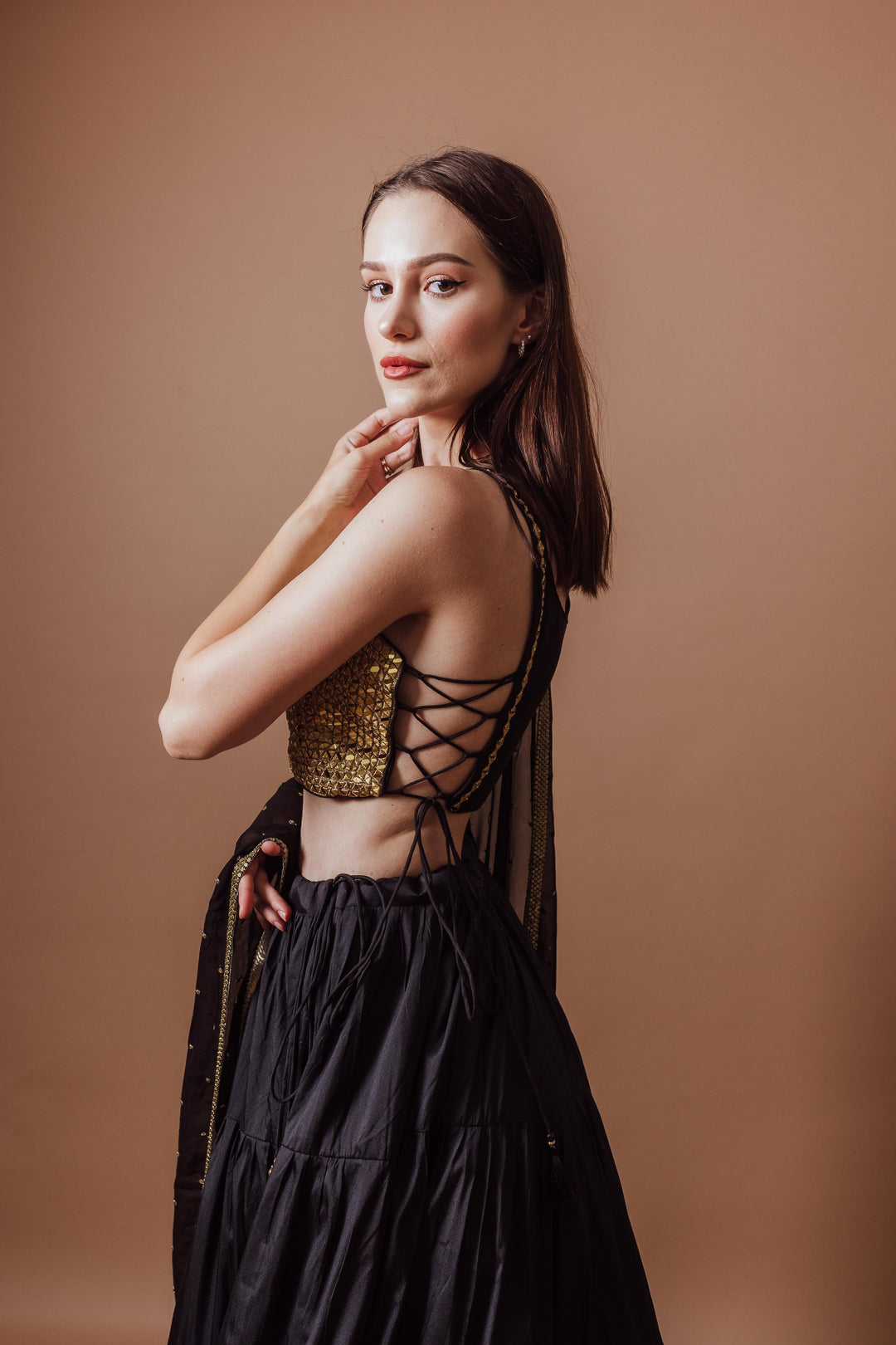 Victoria Black and Gold Lehenga with mirror work blouse, lace-up back, and flowing black skirt, perfect for Garba.