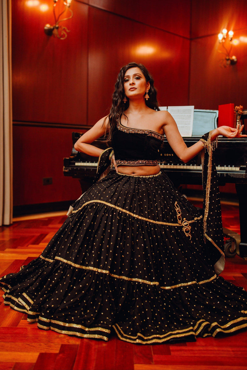 Black and Gold One Shoulder Lehenga Choli Set with sequins work Raas Black and Gold One Shoulder Lehenga Choli Set with sequins work Raas