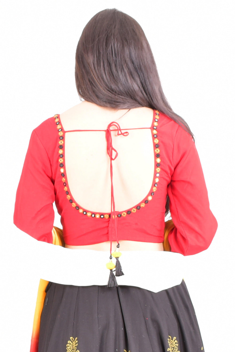 Woman in a red long-sleeve U-back blouse with gold embroidery, black lehenga, and white dupatta.