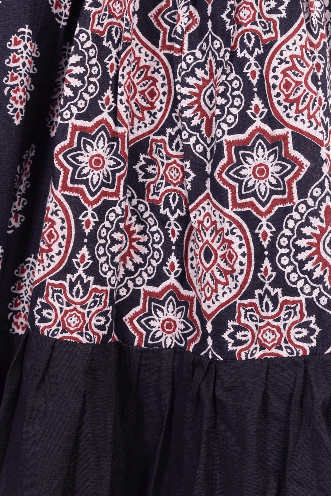 Black and red hand block-printed silk tiered lehenga with a dramatic twirl, perfect for Garba.