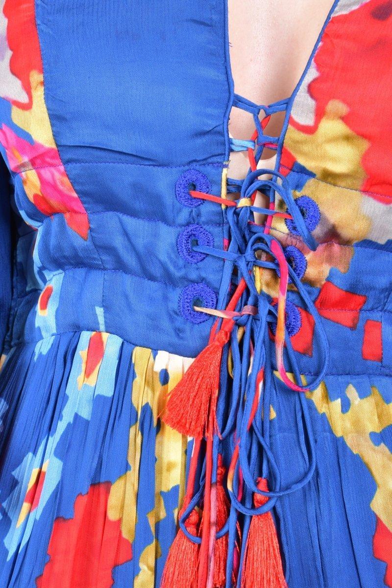 Blue chiffon maxi dress with vibrant floral print, angel sleeves, and a lace-up tassel bodice.