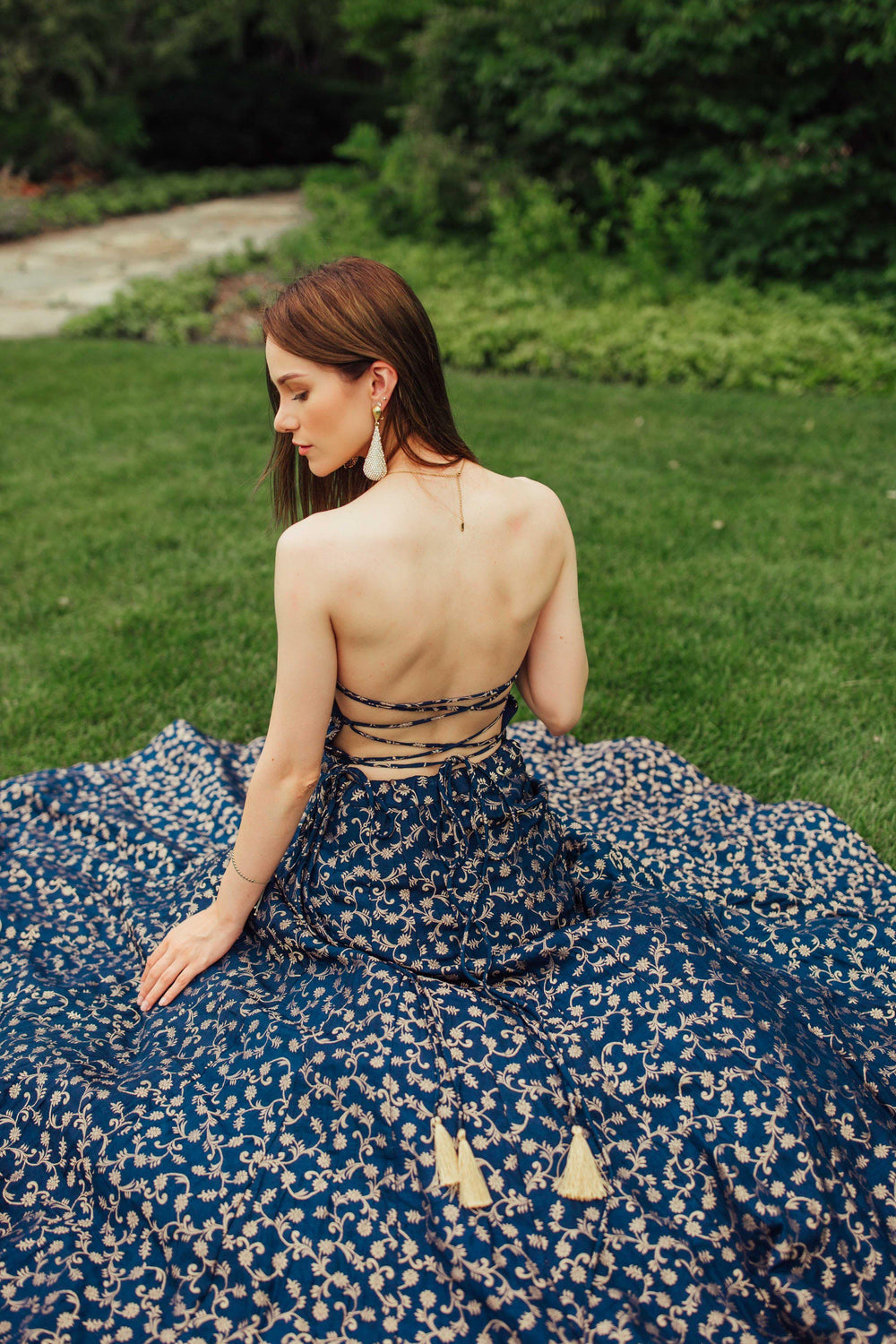Blue silk brocade convertible gown with intricate weaving, open back, and string tie closure.