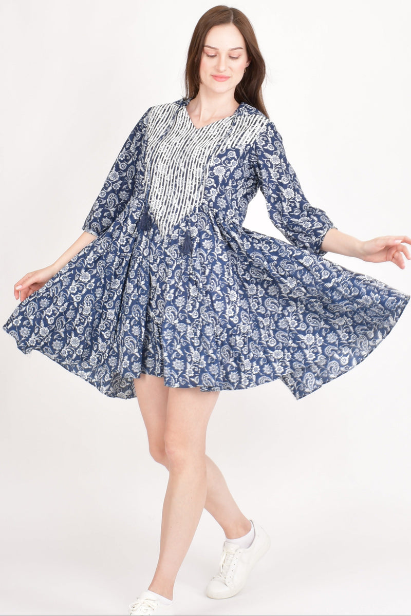 Blue cotton floral mini dress with white resham embroidery, 3/4 sleeves, and a flowing silhouette.