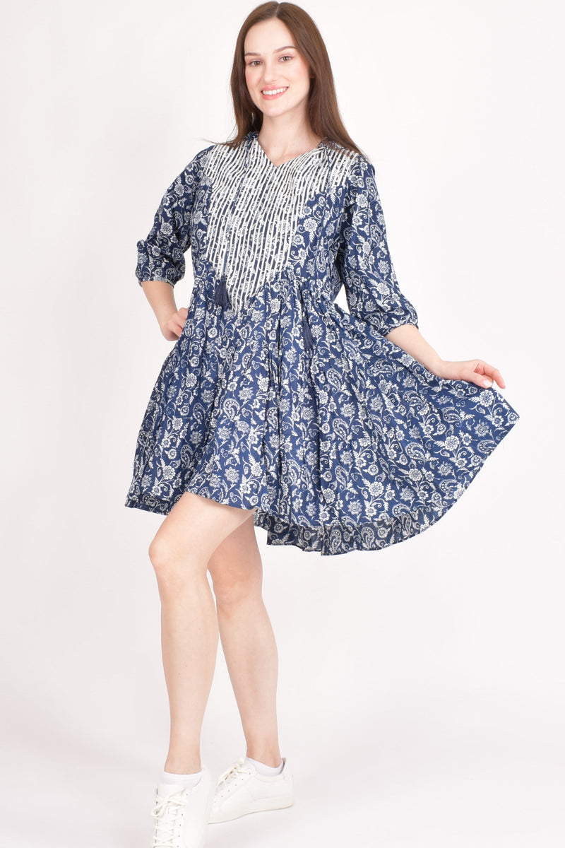 Blue cotton floral embroidered hoodie mini dress with white resham embroidery on the neckline.