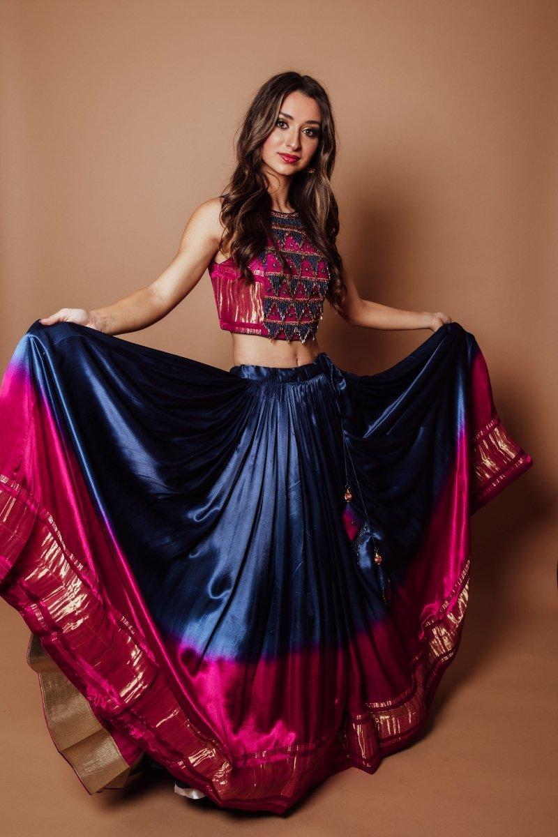 Blue Gaji silk lehenga choli with a vibrant pink lagdi patta border and embroidered blouse, perfect for Garba.