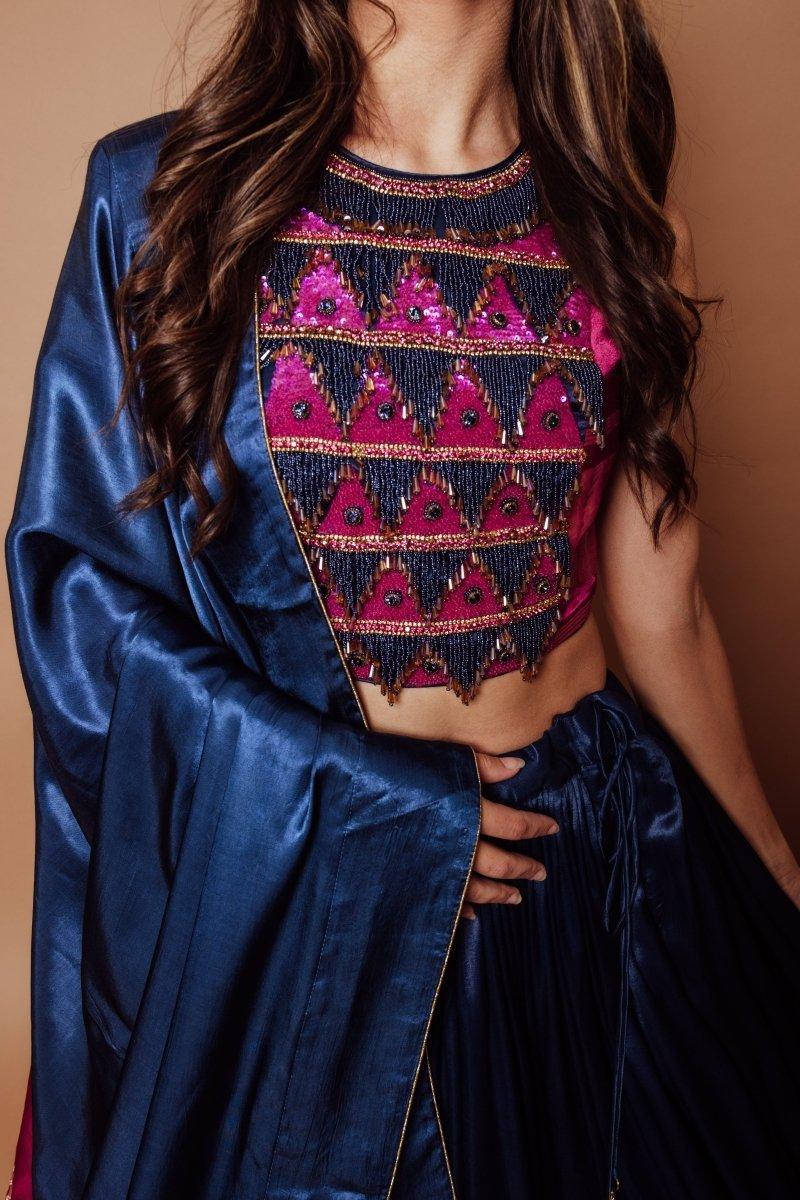 Blue Gaji silk lehenga choli with heavily embroidered pink and navy blouse, perfect for dramatic twirls.