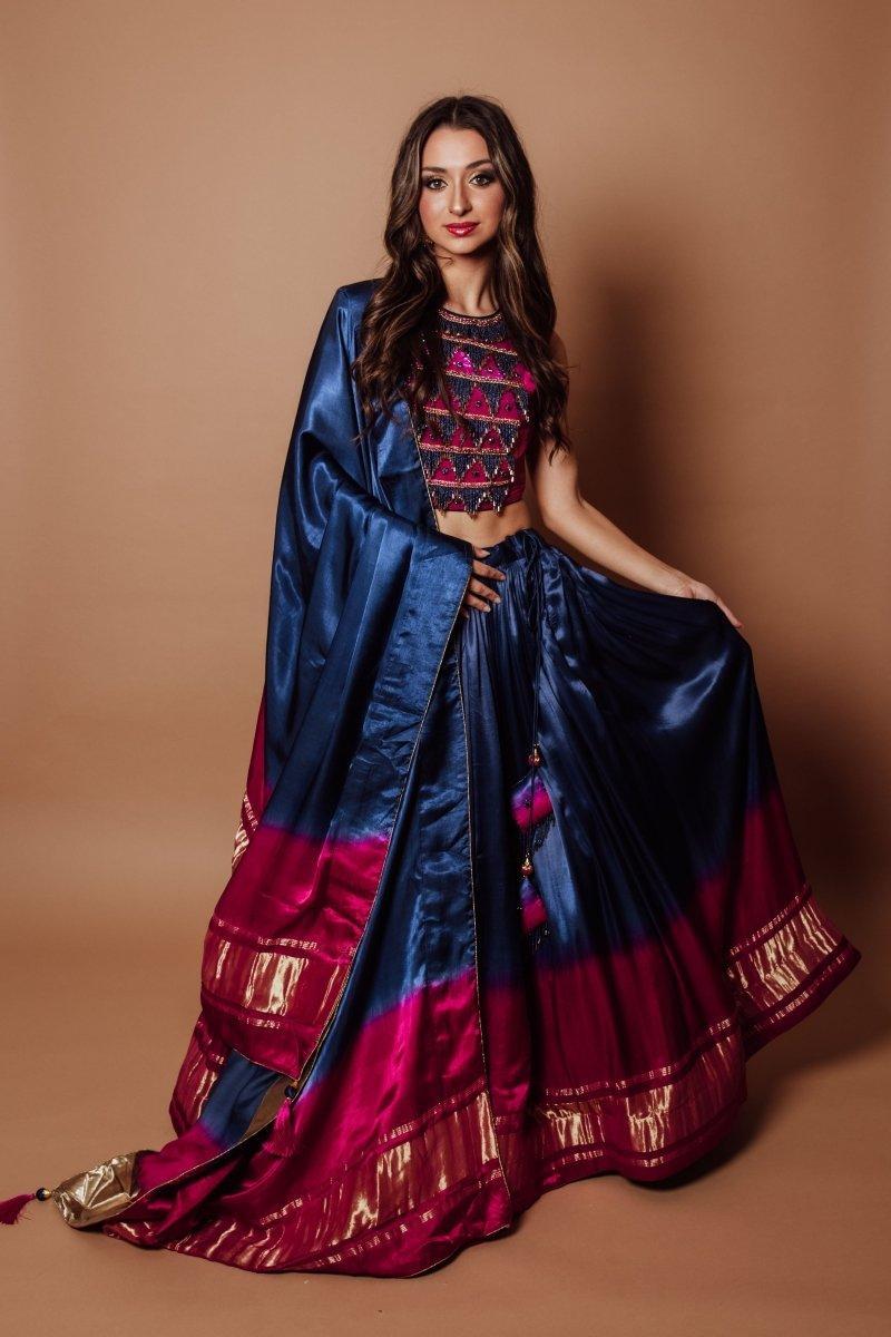 Blue Gaji silk lehenga choli with heavy embroidered blouse, lagdi patta border, and matching dupatta.