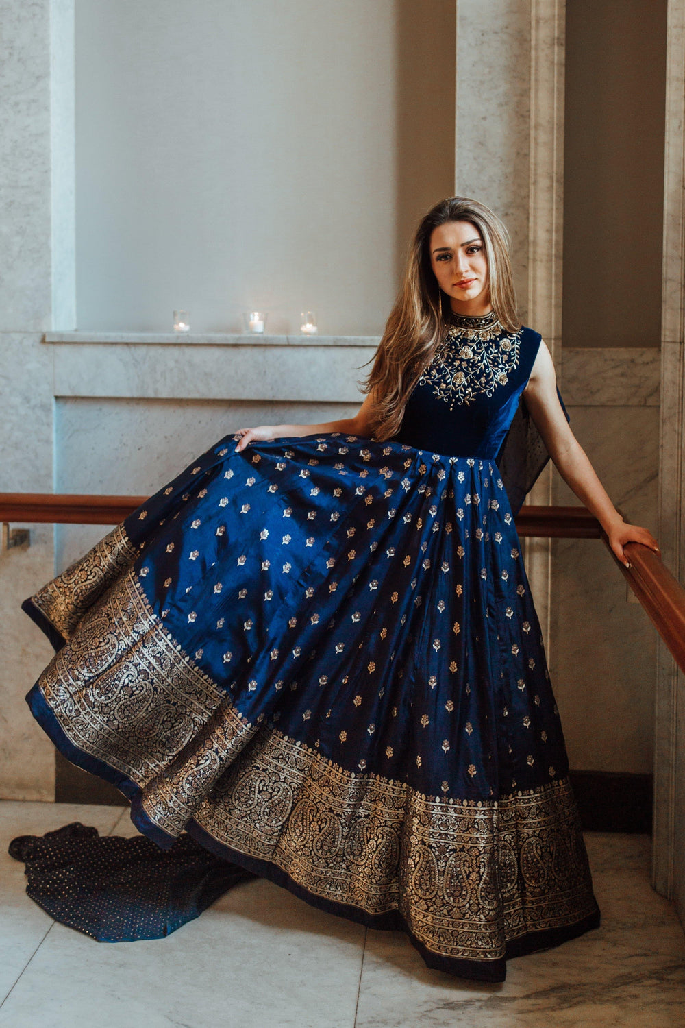 Blue Banarasi silk gown with velvet hand-embroidered torso, Banarasi Jacquard hem, and mukaish work drape.