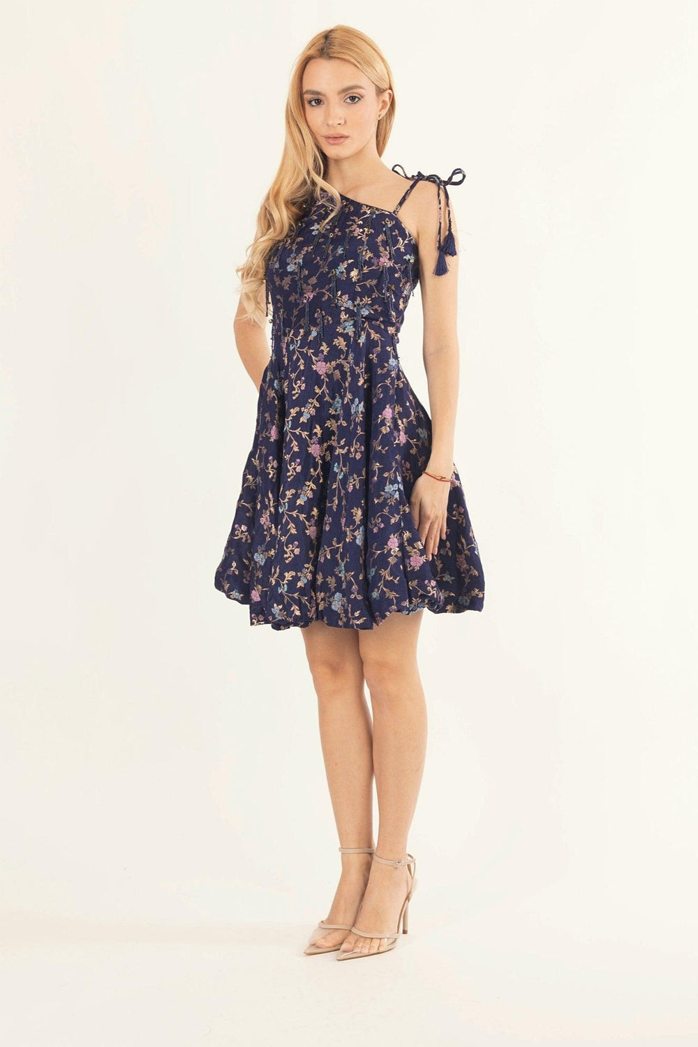 Blue floral jacquard silk one-shoulder fit and flare short dress with tie straps.