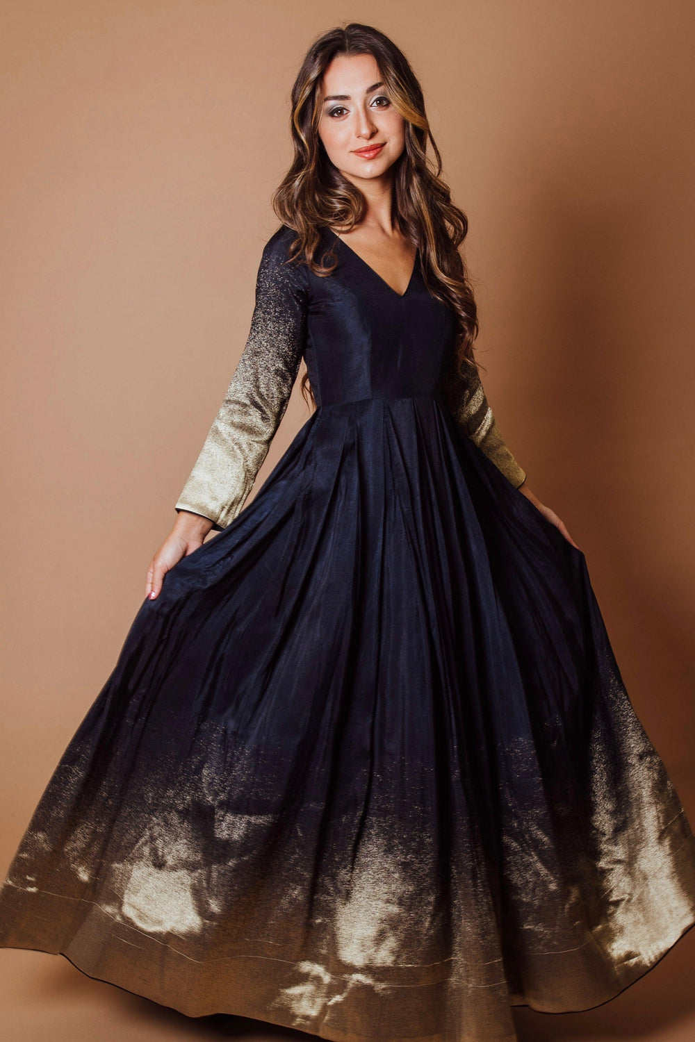 Navy blue silk long sleeve dress with a golden border and matching sleeves.