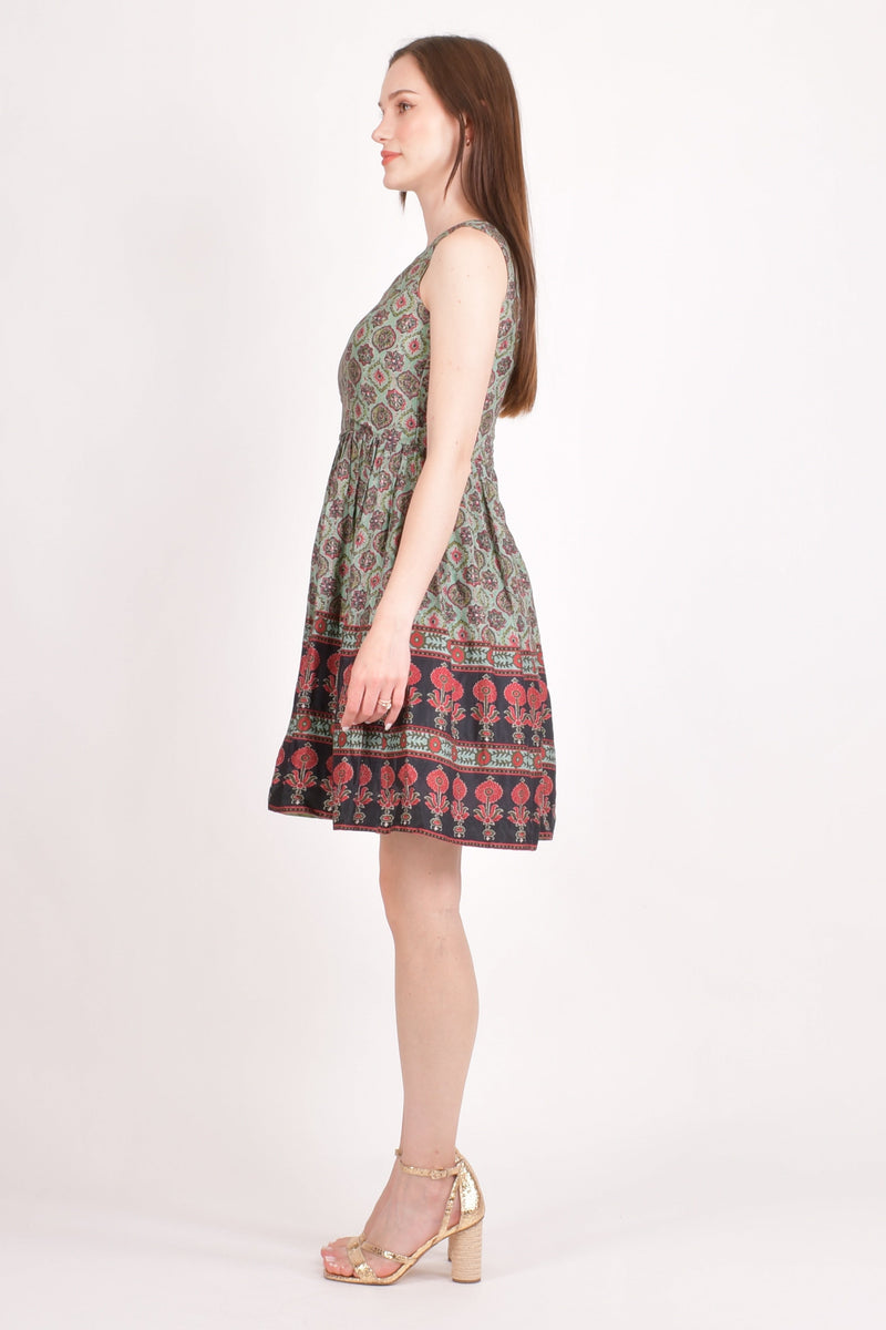 Hazel One Shoulder Mini Dress in green muslin silk with all-over Ajrakh print and red & black floral border.