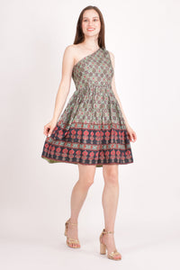 Hazel One Shoulder Mini Dress in green muslin silk with all-over Ajrakh print and red & black floral border.