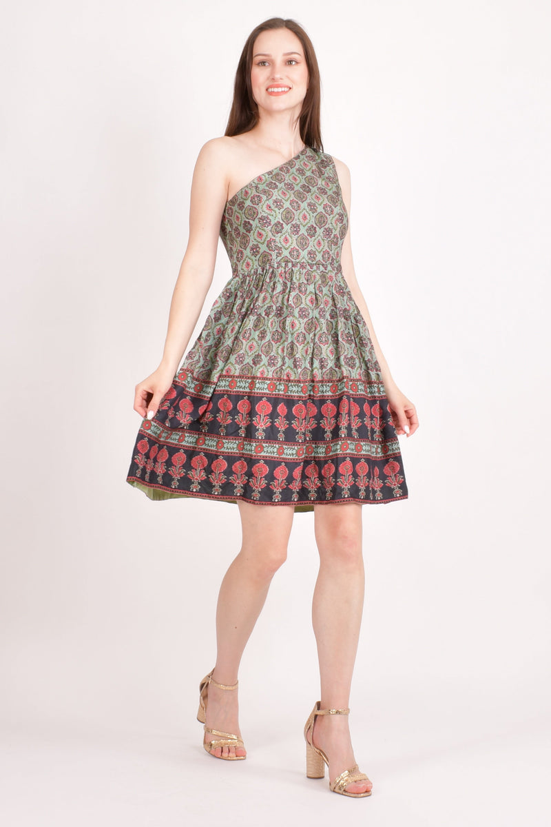 Hazel One Shoulder Mini Dress in green muslin silk with all-over Ajrakh print and red & black floral border.