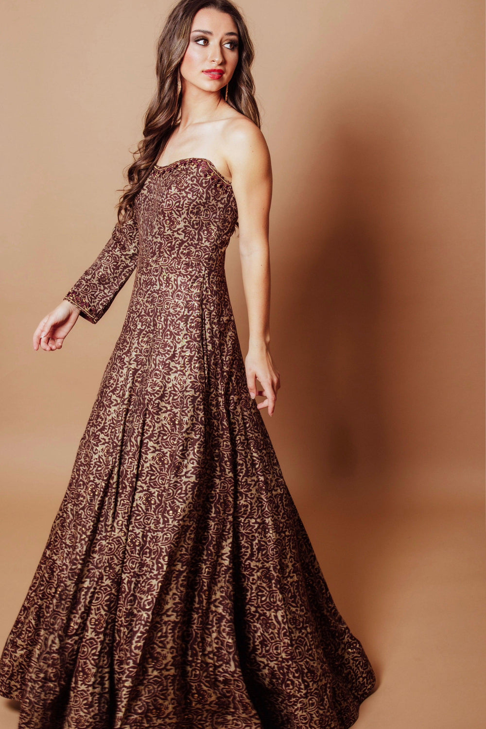Brown cotton-silk one-shoulder gown with scrolling vine resham and kasab embroidery, A-line skirt.