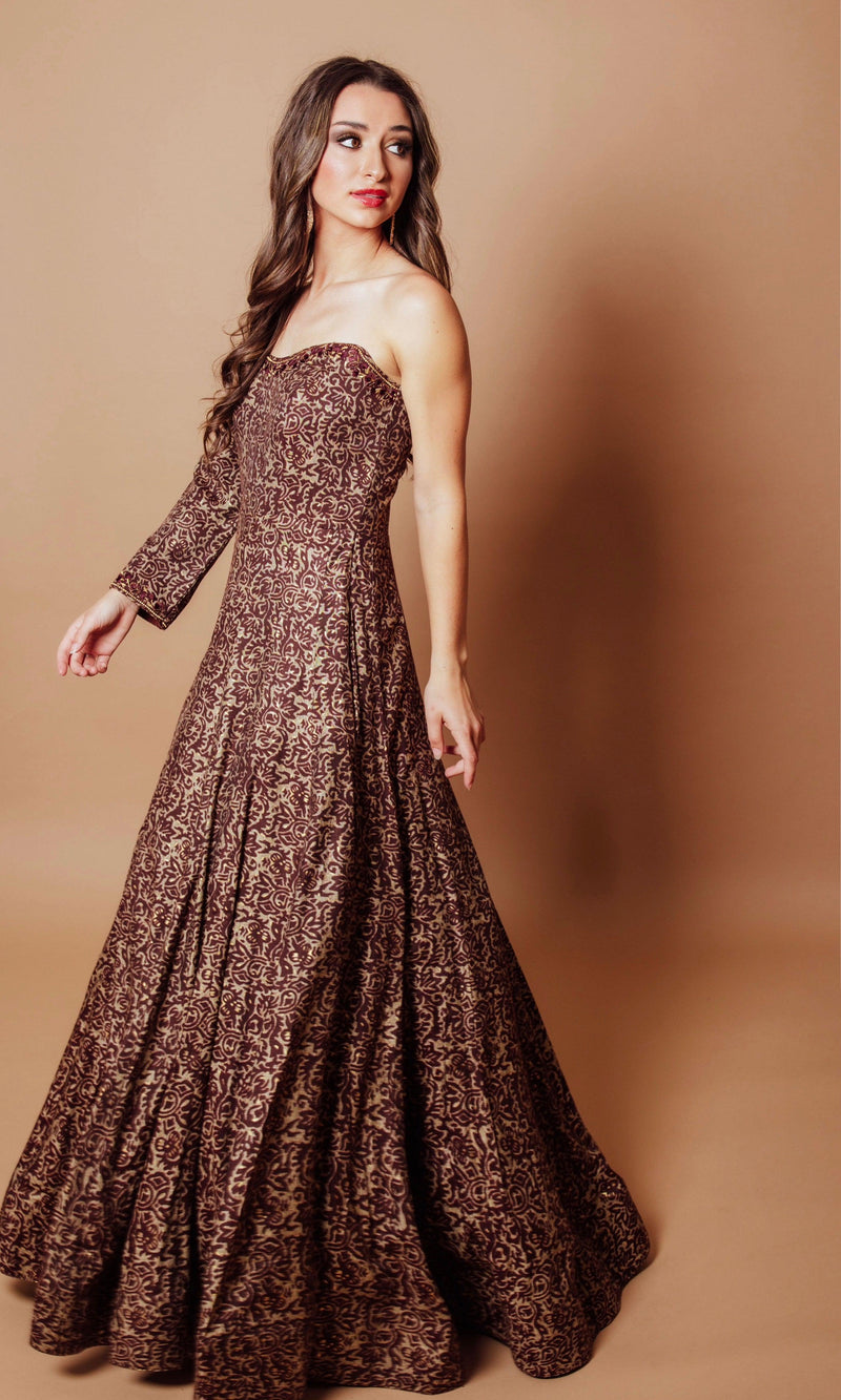 Brown cotton-silk one-shoulder gown with scrolling vine resham and kasab embroidery, A-line skirt.
