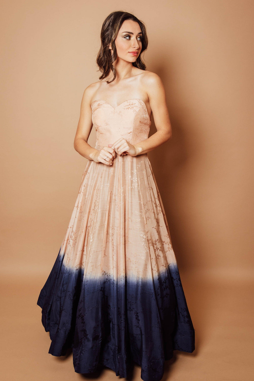 Silk off-shoulder jacquard ombre long dress, peach transitioning to blue, with elegant texture.