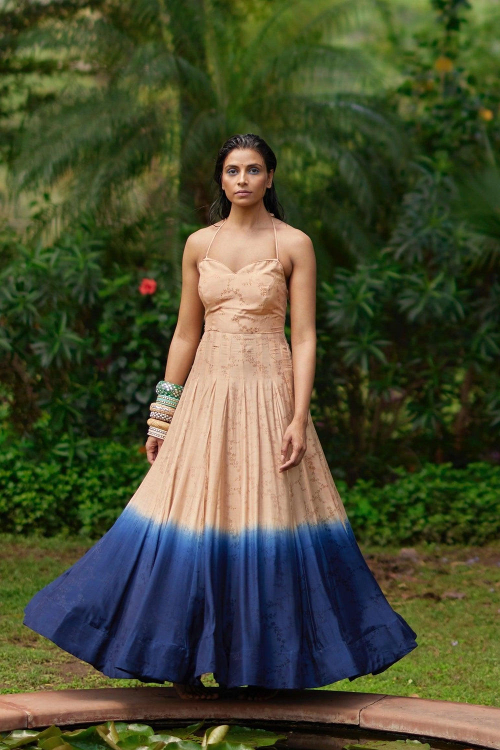 Silk jacquard ombre long dress, peach transitioning to blue, with an off-shoulder design.