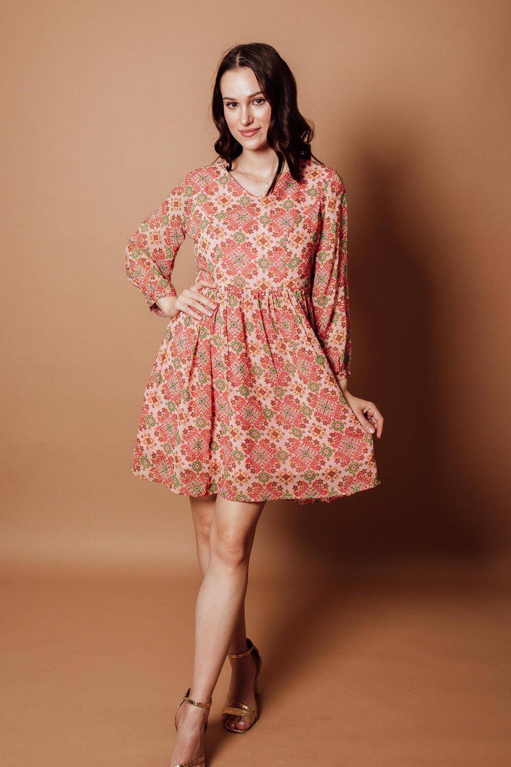 Floral Georgette V-Neck Mini Dress in coral, pink, and sage geometric print with long sleeves.
